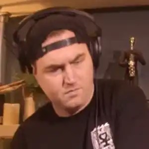 Mitch Dodge wearing headphones at the decks